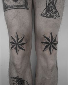 two tattoos on the legs of a man