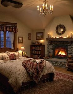 a bedroom with a fireplace and bed in it