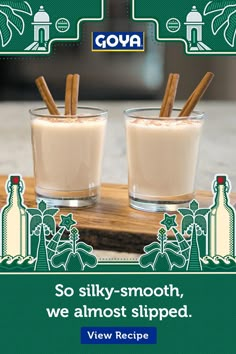 an advertisement for goya with two glasses of milk and cinnamon sticks in the middle