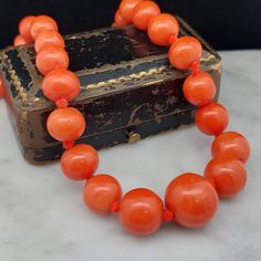 An amazing Victorian coral necklace with substantial sized beads. Measuring 21.5 inches in length with the largest coral 14mm in diameter.  PERIOD - Circa 1890 STONE - Genuine Natural Red Coral   METAL - Silver MEASUREMENTS - 5.6mm to 14mm LENGTH - 21.5 inches WEIGHT - 50.2 grams CONDITION - Very Good, wear consistent with age Vintage Red Coral Single Strand Beaded Necklace, Vintage Single Strand Red Coral Beaded Necklace, Vintage Single Strand Red Coral Beaded Necklaces, Vintage Orange Beaded Necklaces For Formal Occasions, Vintage Coral Beaded Necklace In Red Coral, Vintage Coral Beaded Necklaces In Red Coral, Vintage Coral Beaded Necklaces, Vintage Red Coral Round Bead Jewelry, Vintage Red Coral Round Bead Necklace