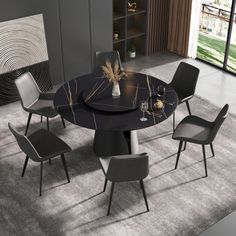 a round table with four chairs around it