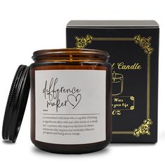 an open jar of candle next to a black box with the label afflence maker on it