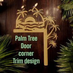 the palm tree door corner trim design is cut out and placed on a wood paneled wall