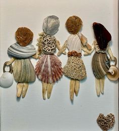 an image of four dolls made out of seashells