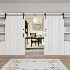 a living room with white walls and sliding doors