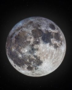 the full moon is shown in the dark sky