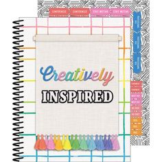 a notebook with the words creatively inspired on it