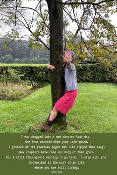 a woman leaning up against a tree with her hand on the trunk, and an inscription below