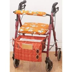 a red walker with an orange flowered seat cover on the front and back wheels