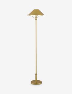 a gold floor lamp with a white background