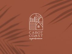 the cabot coast experience logo on an orange wall with palm leaves in front of it