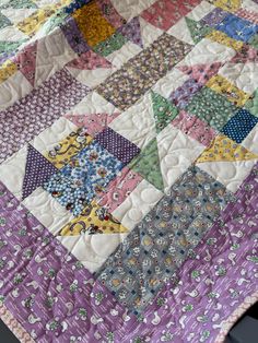 a close up of a quilt on a table