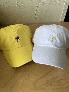 Great for vaca or bach! Lemon colored dad hat embroidered with black polyester thread Comfortable with a cool crown mesh lining on the inside Adjustable on the backside with a brown leather strap One size fits most *Ask about other hat color options Ships in 3-4 business days Brown Leather Strap, Dad Hat, Hat Designs, Palm Tree, Dad Hats, Palm Trees, Color Options, Leather Straps, Brown Leather