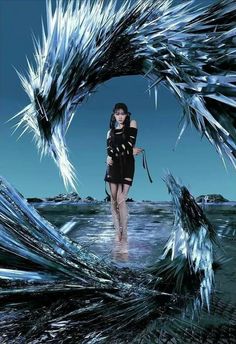 a woman is walking through an ice cave