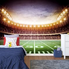 a bedroom with a football field wall mural