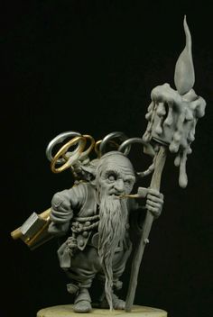 a figurine is holding a key in his hand