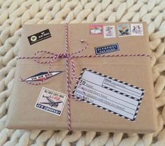 a wrapped package with some stickers and tags on it