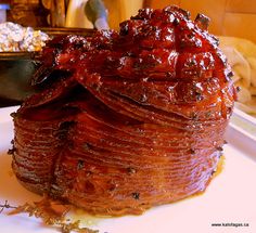 a large stack of pancakes sitting on top of a white plate