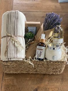 a wicker basket filled with soaps, body lotion and handmade towels