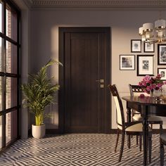 a dining room table with chairs and pictures on the wall above it, along with potted plants