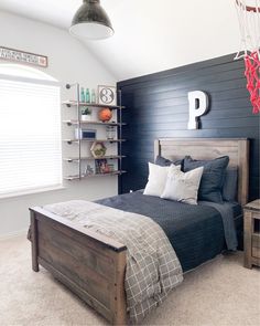 a bedroom with black walls and white carpet