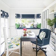 a living room with blue and white furniture