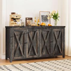 a wooden buffet table sitting on top of a hard wood floor next to a white rug