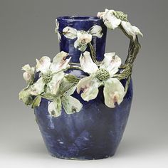 a blue vase with white flowers in it