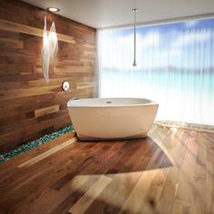 a bath tub sitting on top of a wooden floor