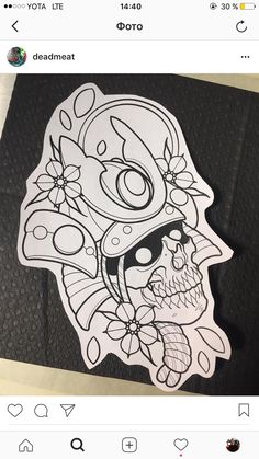 a sticker with a skull and flowers on it