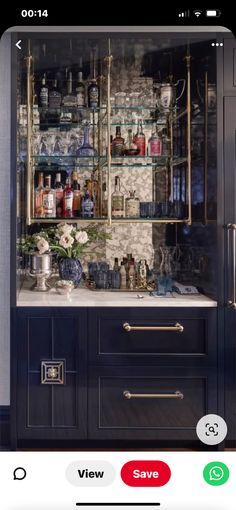 the kitchen is decorated in blue and gold, with shelves full of dishes on them