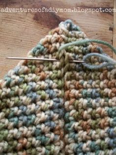 a crocheted jacket is being worked on