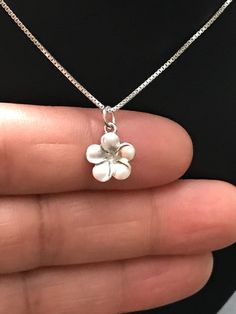 Small Sterling Silver Plumeria Flower Necklace Metal: All components are made from solid .925 Sterling Silver Measurement: 10mm plumeria pendant Choose Chain Length At Checkout Please feel free to Convo me with any questions before purchasing. Please view policy before purchasing You can find other charm jewelry in my shop here https://www.etsy.com/shop/LinksAndStones?ref=seller-platform-mcnav§ion_id=24389019 Thank You For Visiting My Shop Sterling Silver Flower Necklace, Flower Girl Necklace, Summary Writing, Silver Necklace Simple, Silver Flower Necklace, Pretty Jewelry Necklaces, Flower Charm Necklace, Girl Necklace, Jewelry Lookbook