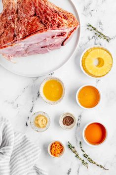 raw meat on a plate surrounded by sauces and condiments