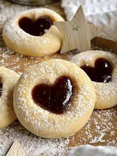 some sugar cookies with jam in the middle