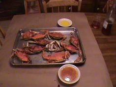 there are some crab on the table ready to be cooked in the oven and served