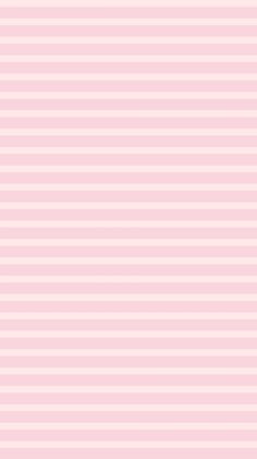 a pink and white striped wallpaper with vertical lines