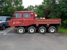 a large red truck parked in a parking lot