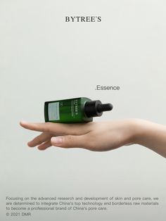 a hand holding a bottle of green essentials on it's left side, with the caption bytree's