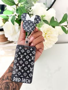 The LV Ear Badge Reel is an elegant and playful accessory, inspired by the iconic Loui Vuitton design and the beloved minnie mouse character. Add a touch of luxury and whimsy to your office attire with this eye-catching badge reel. Medical Scrubs Outfit, Badge Buddy, Badge Reel, Resin Crafts, Minnie Mouse