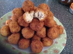 there is a plate full of fried food on the table