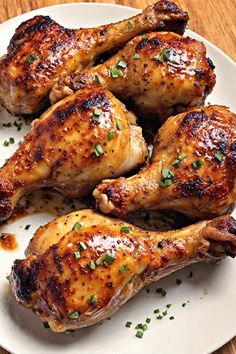 three pieces of chicken on a white plate