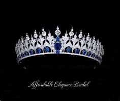 Sapphire Blue Royal Replica Tiara and Earrings You'll fall in love with this stunning tiara with coordinating sapphire blue earrings. This regal tiara is a replica of the 1881 Dutch Sapphire royal tiara, with a smaller height to appeal to today's modern bride. This fabulous headpiece features a lavish platinum plated design decorated with brilliant clear and sapphire blue AAAAA quality cubic zirconia crystals. The stunning tiara will have you feeling like royalty on your special day. The coordin Dani Martin, Beautiful Crowns, Sapphire Blue Earrings, Winter Wedding Accessories, Gold Bridesmaid Jewelry, Rose Gold Wedding Jewelry, Flower Girl Jewelry, Royal Tiaras, Beautiful Tiaras