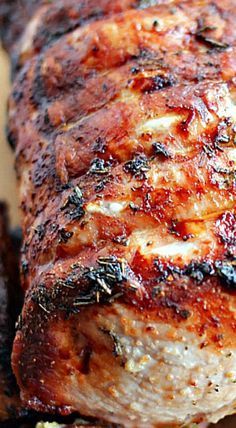 a close up of meat on a cutting board