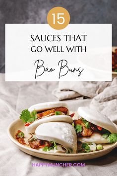 two burritos on a plate with the words 15 sauces that go well with bao