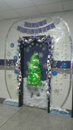 a decorated door with a christmas tree and snowflakes