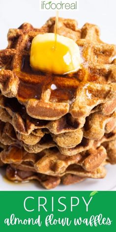 a stack of waffles with syrup on top and the words crispy almond flour waffles