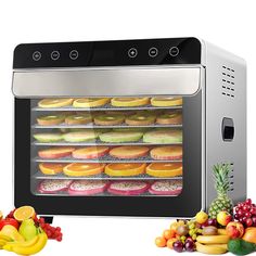 an oven with many different types of pastries in it and fruit on the side