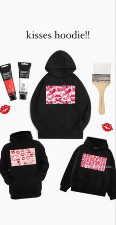 a black hoodie with lipstick print on it and other items surrounding the image, including a brush