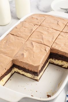 there is a cake that has been cut in half on the plate and ready to be eaten